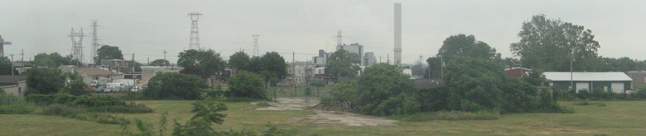 Grass, trees, and industrial scenery
